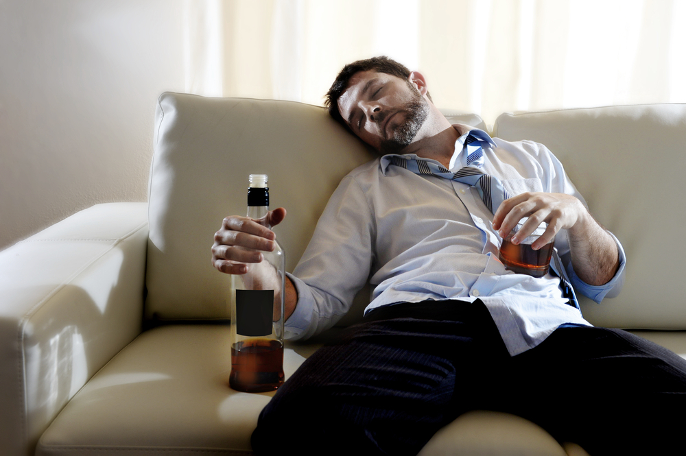 Addicted man sleeping after drinking